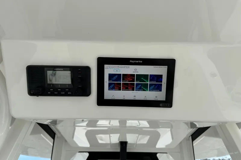  Yacht Photos Pics 2022 Regulator 34 boat dashboard with Garmin and Raymarine navigation displays.