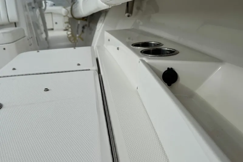  Yacht Photos Pics 2022 Regulator 34 boat interior with cup holders and storage compartments.