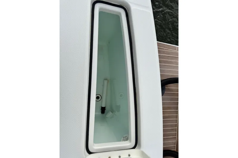  Yacht Photos Pics Livewell compartment on 2022 Regulator 34 boat, featuring a clean, white interior.