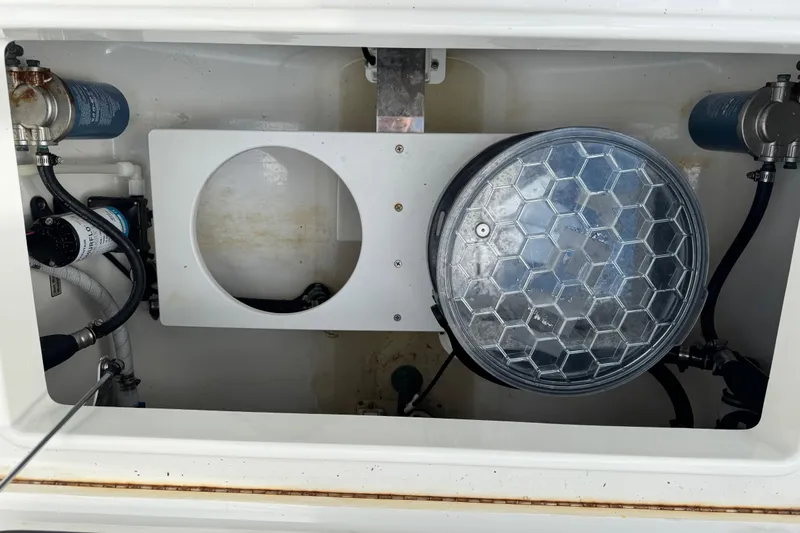  Yacht Photos Pics 2022 Regulator 34 boat compartment with filters and wiring components.