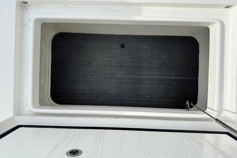  Yacht Photos Pics Storage compartment of 2022 Regulator 34 boat, featuring a black non-slip surface.