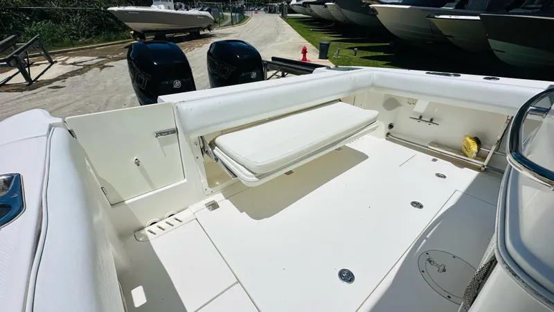  Yacht Photos Pics 2013 Boston Whaler 320 Outrage boat deck with seating and twin engines.