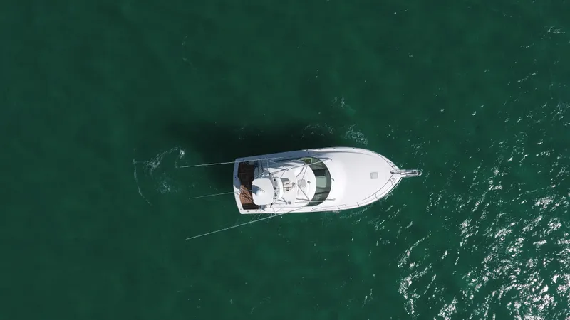 Yacht Photos Pics Aerial view of 2014 Viking 42 Sport Tower yacht on open water.