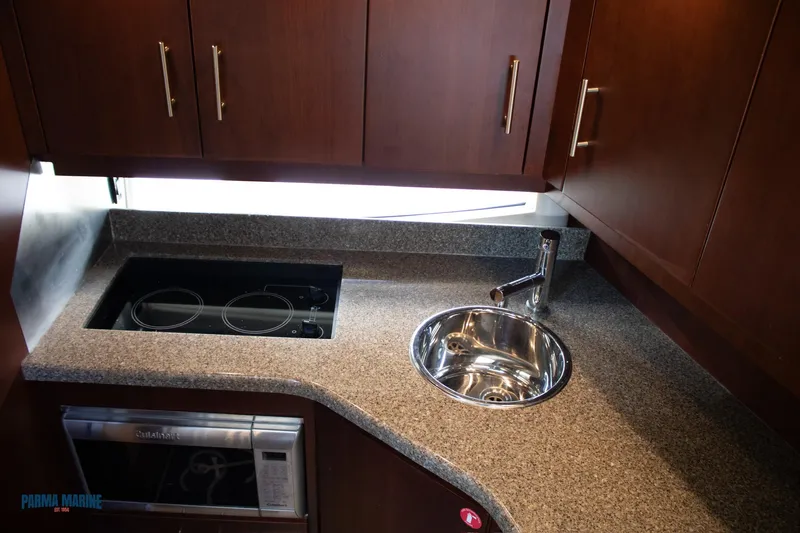 Knot On Call Yacht Photos Pics Galley Range, Sink, and Microwave