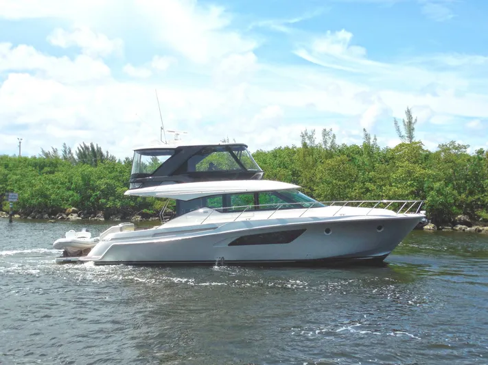 True North Yacht Photos Pics 2017 Tiara Yachts F53 Flybridge cruising on a sunny day.
