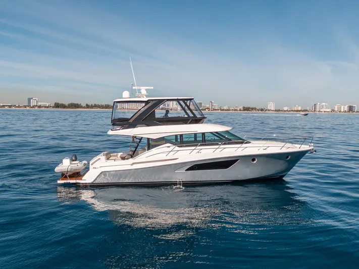 True North Yacht Photos Pics 2017 Tiara Yachts F53 Flybridge cruising on calm blue waters.