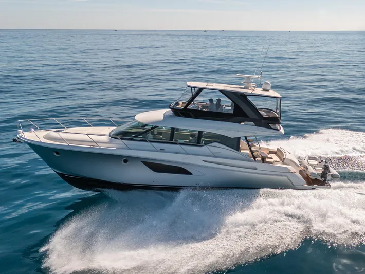 True North Yacht Photos Pics 2017 Tiara Yachts F53 Flybridge cruising on open water.