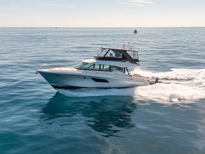 True North Yacht Photos Pics 2017 Tiara Yachts F53 Flybridge cruising on open water.