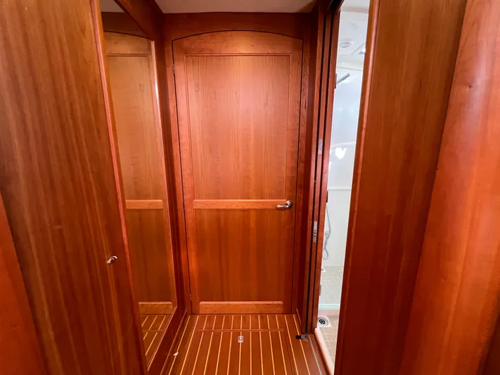Family Affair Ix Yacht Photos Pics Interior of 2018 Sabre 45 Salon Express with wooden doors and flooring.