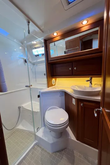 Family Affair Ix Yacht Photos Pics Luxurious bathroom in 2018 Sabre 45 Salon Express yacht with modern fixtures and wood accents.