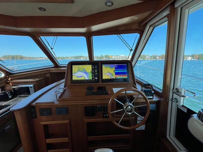 Family Affair Ix Yacht Photos Pics 2018 Sabre 45 Salon Express helm with navigation screens and steering wheel.