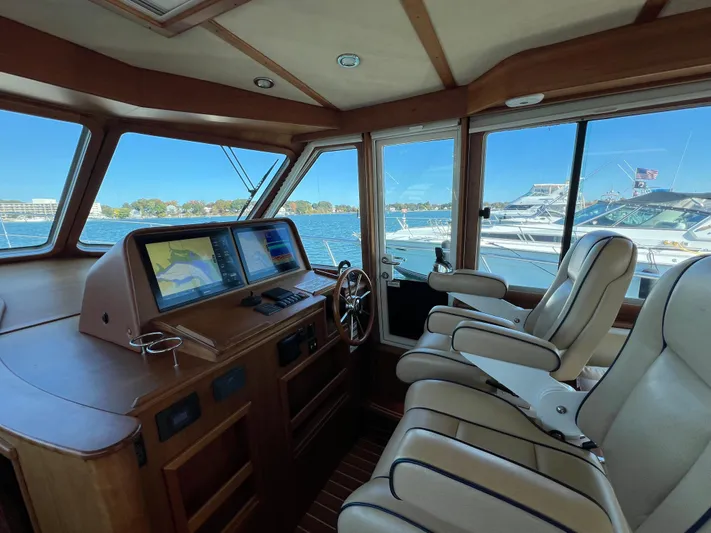 Family Affair Ix Yacht Photos Pics Interior of 2018 Sabre 45 Salon Express yacht with navigation system and leather seats.