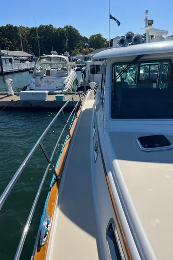Family Affair Ix Yacht Photos Pics 2018 Sabre 45 Salon Express yacht docked at marina, sunny day.
