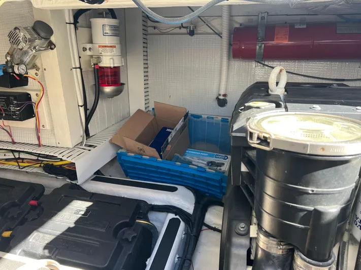 Family Affair Ix Yacht Photos Pics Engine room of 2018 Sabre 45 Salon Express with equipment and storage boxes.