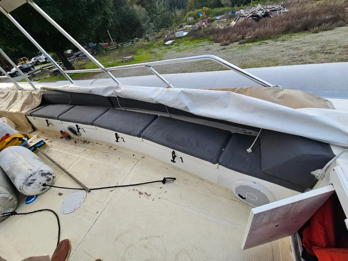 Ocean Spirit Yacht Photos Pics 1996 Eduardono RIB boat interior with cushioned seating and open storage compartments.