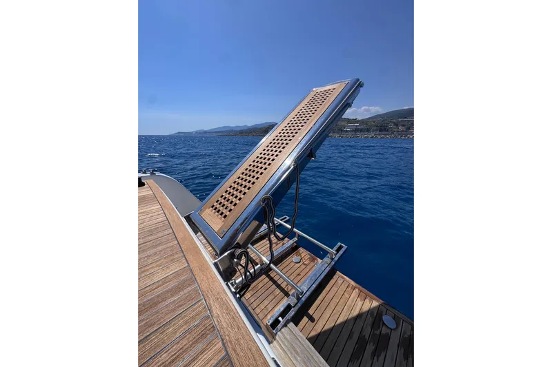  Yacht Photos Pics Cantieri Lombardi 48 S yacht deck with a raised gangway, 1998 model, overlooking the sea.