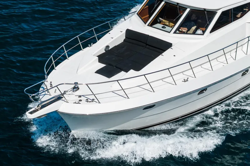 Freedom Yacht Photos Pics 2002 McKinna 57 Pilothouse yacht cruising on blue ocean waters.