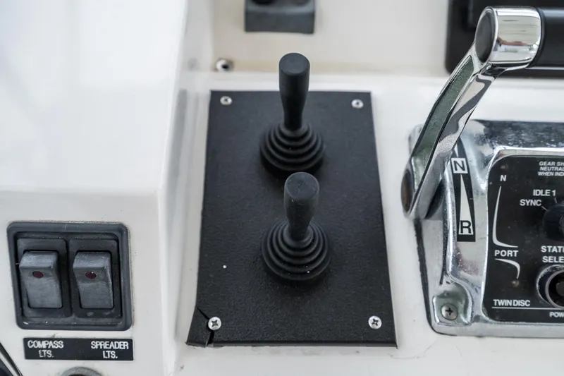 Freedom Yacht Photos Pics Control panel of a 2002 McKinna 57 Pilothouse yacht with joysticks and switches.