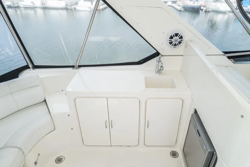 Freedom Yacht Photos Pics 2002 McKinna 57 Pilothouse yacht interior with sink and storage cabinets.