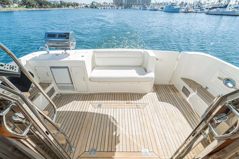 Freedom Yacht Photos Pics Luxurious 2002 McKinna 57 Pilothouse yacht deck with seating and ocean view.