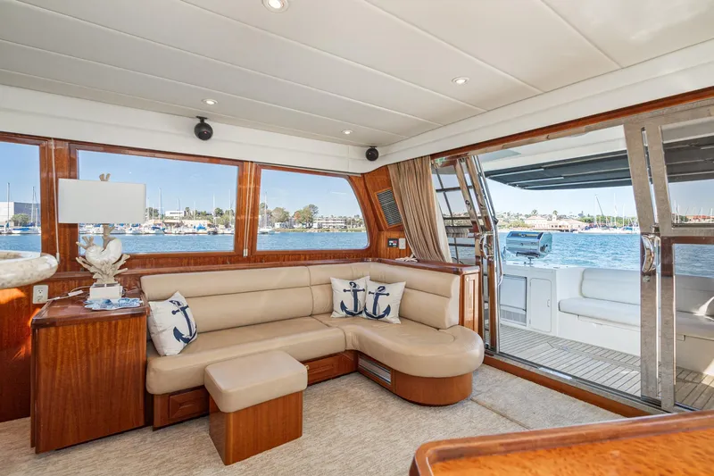 Freedom Yacht Photos Pics Luxurious interior of 2002 McKinna 57 Pilothouse yacht with waterfront view.
