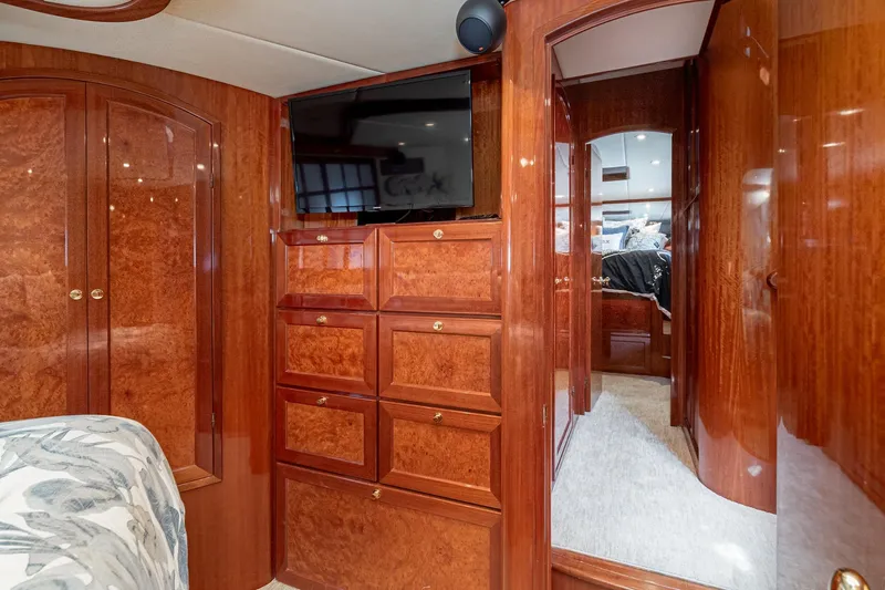 Freedom Yacht Photos Pics Luxurious interior of 2002 McKinna 57 Pilothouse yacht with wood cabinetry and modern amenities.