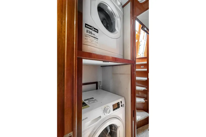 Freedom Yacht Photos Pics Laundry area with washer and dryer in 2002 McKinna 57 Pilothouse yacht.