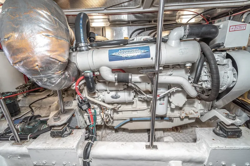 Freedom Yacht Photos Pics Engine room of 2002 McKinna 57 Pilothouse yacht, showcasing detailed machinery components.