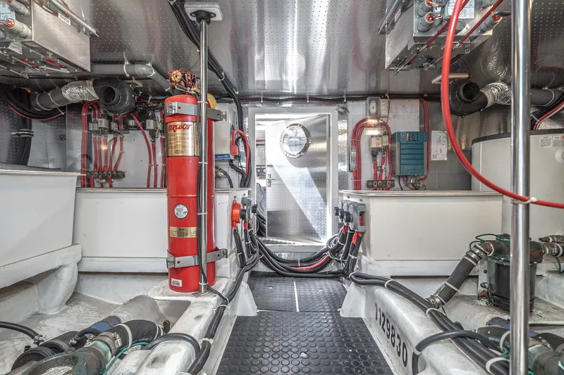 Freedom Yacht Photos Pics Engine room of 2002 McKinna 57 Pilothouse yacht, featuring equipment and wiring.