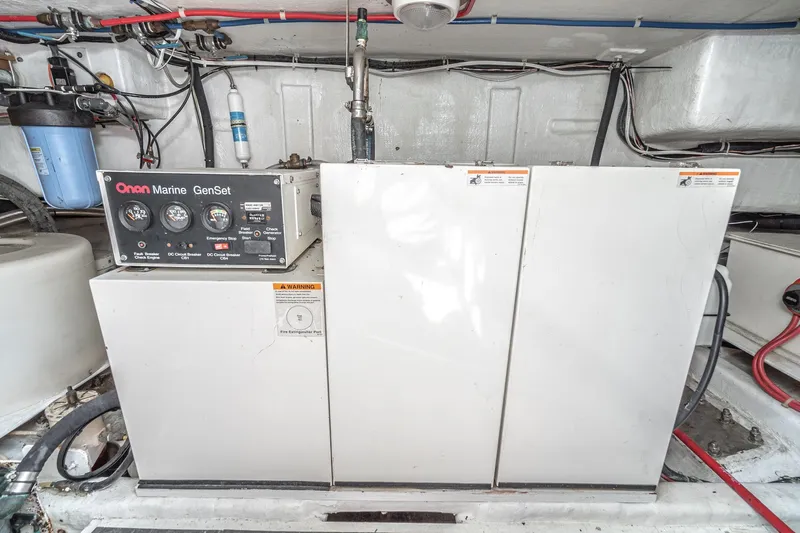 Freedom Yacht Photos Pics Engine room of 2002 McKinna 57 Pilothouse with Onan Marine GenSet generator.