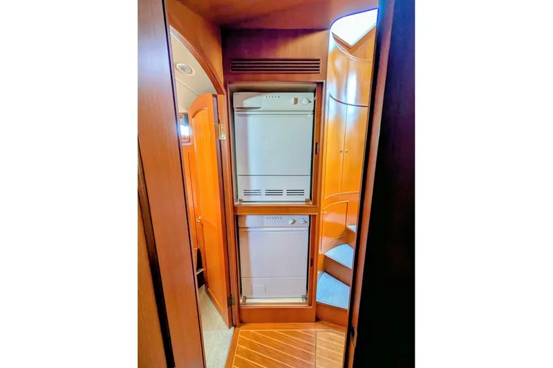 Freedom Yacht Photos Pics 2005 Offshore Yachts Pilothouse interior with stacked washer and dryer unit.