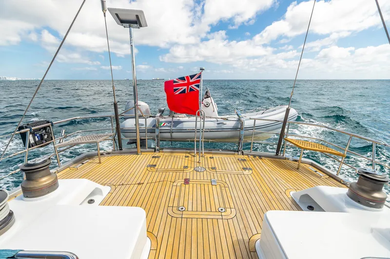 Assai Yacht Photos Pics Deck view of 2011 Alia Yachts Warwick 82 LK with tender and ocean backdrop.