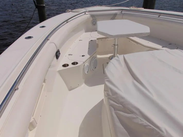 Reel Time Yacht Photos Pics 2013 Boston Whaler 370 Outrage boat interior with seating and table.