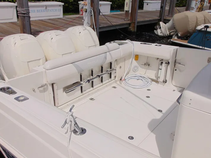 Reel Time Yacht Photos Pics 2013 Boston Whaler 370 Outrage boat deck with triple outboard engines.