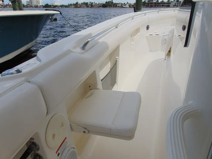 Reel Time Yacht Photos Pics 2013 Boston Whaler 370 Outrage boat interior with white seating and ocean view.