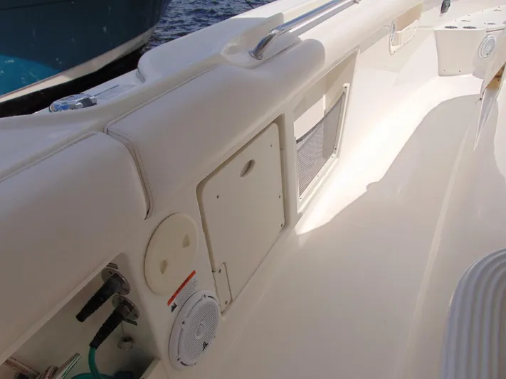 Reel Time Yacht Photos Pics 2013 Boston Whaler 370 Outrage boat interior with storage compartments and speaker.