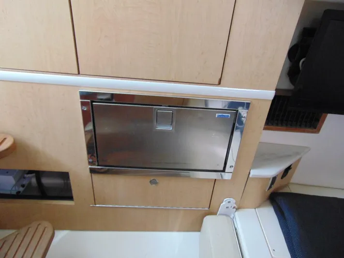 Reel Time Yacht Photos Pics Interior of 2013 Boston Whaler 370 Outrage, featuring a stainless steel cabinet.