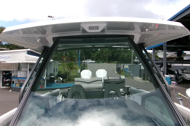  Yacht Photos Pics 2026 Monterey Elite 30 OB boat interior with modern seating and sleek design.