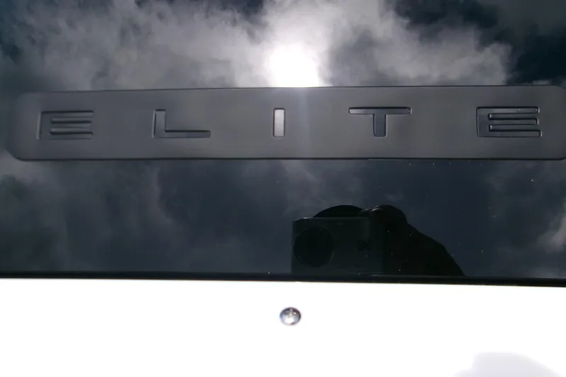  Yacht Photos Pics Monterey Elite 30 OB 2026 logo with reflective surface and cloudy sky background.