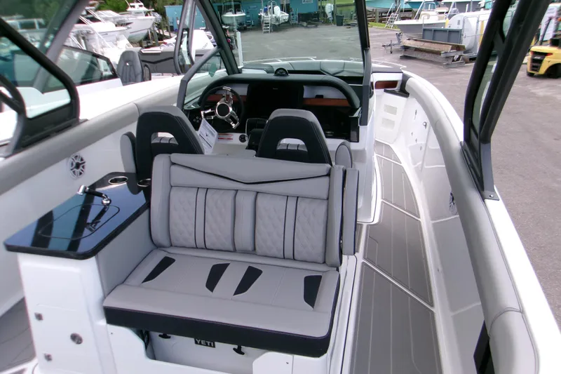  Yacht Photos Pics 2026 Monterey Elite 30 OB boat interior with sleek seating and modern dashboard.