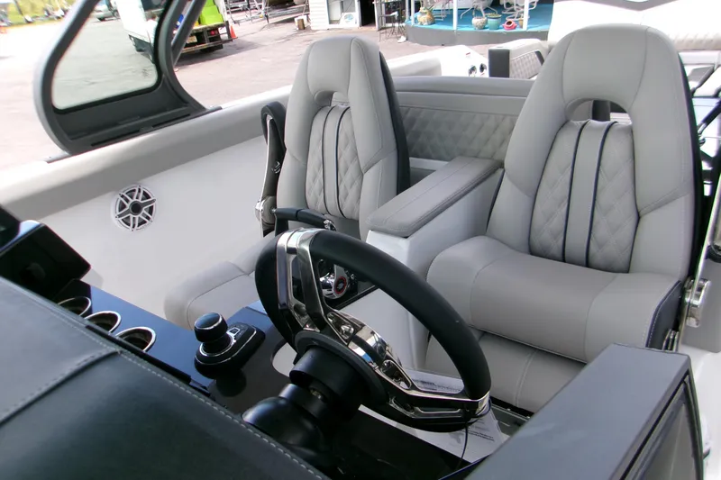  Yacht Photos Pics Luxurious cockpit of 2026 Monterey Elite 30 OB with plush seating and modern controls.