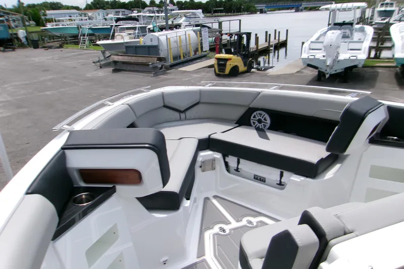  Yacht Photos Pics 2026 Monterey Elite 30 OB boat interior with spacious seating at a marina.