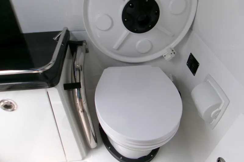  Yacht Photos Pics 2026 Monterey Elite 30 OB boat bathroom with modern toilet and sleek design.