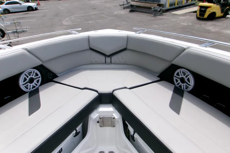  Yacht Photos Pics Luxurious seating area on 2026 Monterey Elite 30 OB boat, featuring sleek design and built-in speakers.