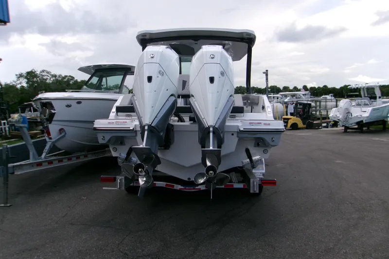  Yacht Photos Pics 2026 Monterey Elite 30 OB boat with dual outboard engines on a trailer.