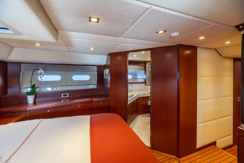 Assai Yacht Photos Pics Luxurious interior of 2011 Alia Yachts Warwick 82 LK with wood finishes and modern lighting.