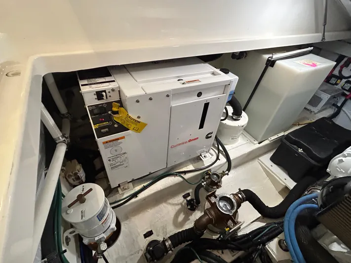  Yacht Photos Pics Engine compartment of a 2015 Back Cove 34 boat, featuring a Cummins Onan generator.