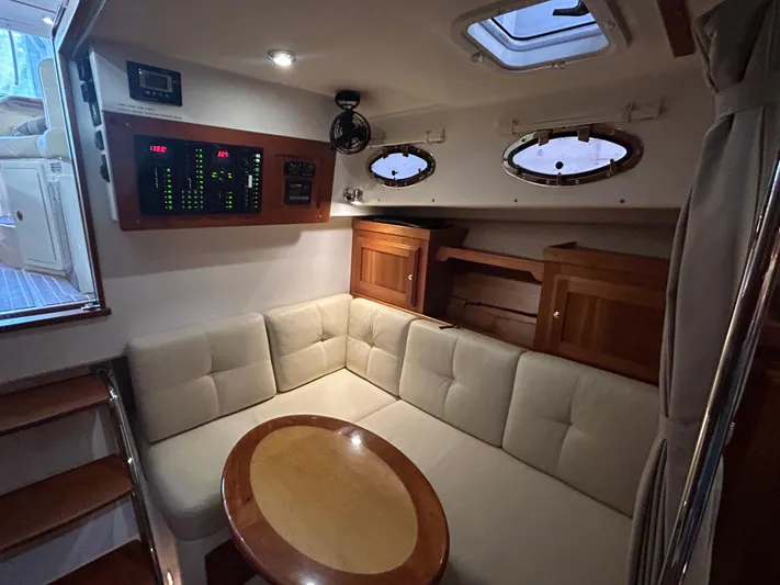  Yacht Photos Pics Luxurious interior of 2015 Back Cove 34 yacht with plush seating and elegant wood finishes.