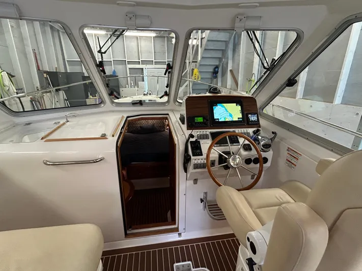  Yacht Photos Pics Interior of a 2015 Back Cove 34 boat, featuring helm with navigation equipment.