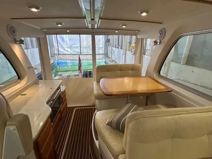  Yacht Photos Pics Interior of 2015 Back Cove 34 yacht with dining area and kitchenette.
